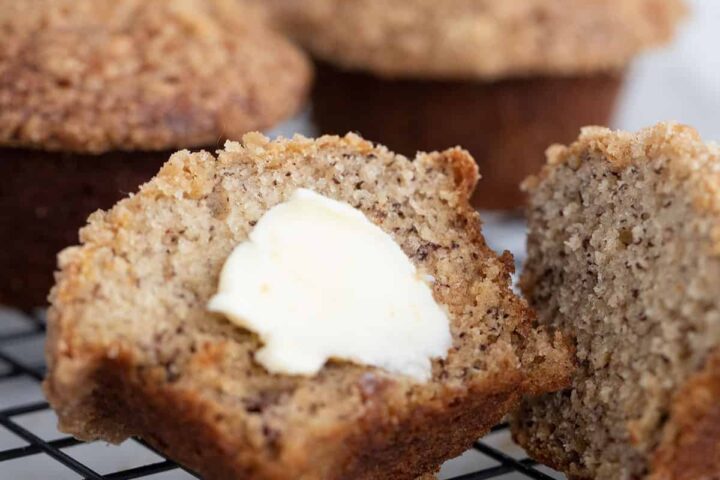 banana crumb muffin sliced with butter
