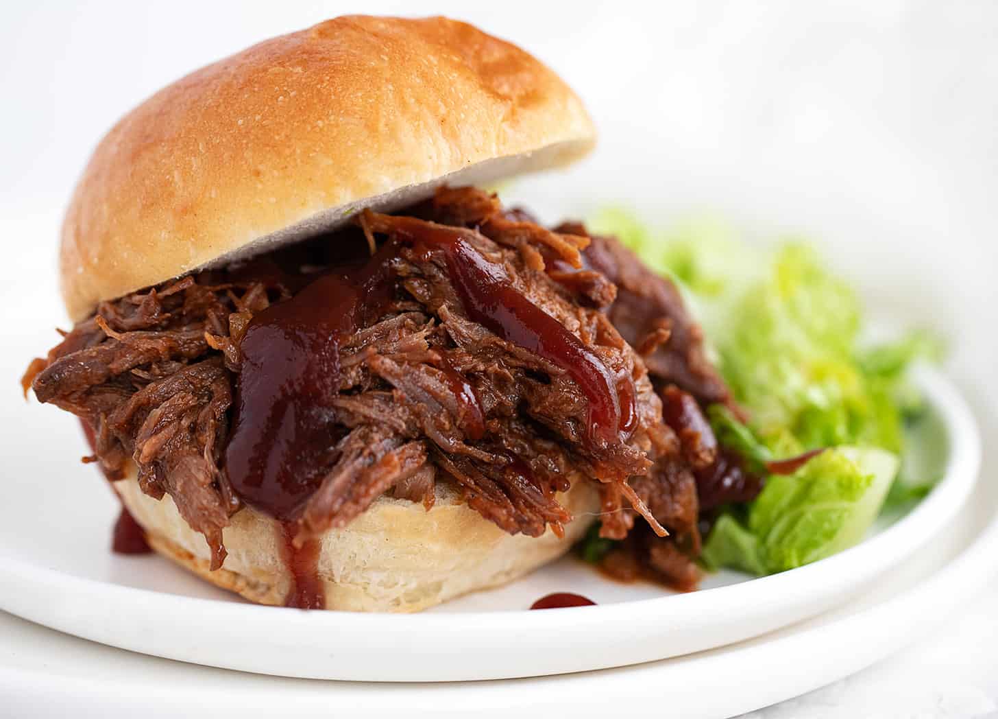 bbq beef on bun with bbq sauce