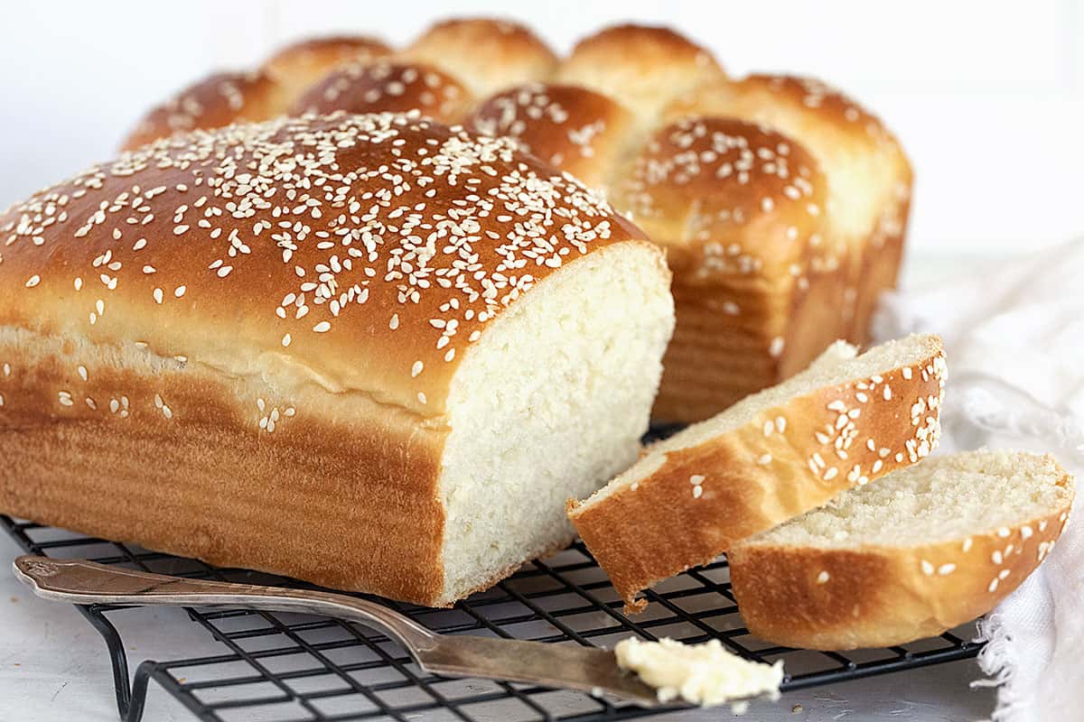 buttermilk bread loaves sliced on cooling rack