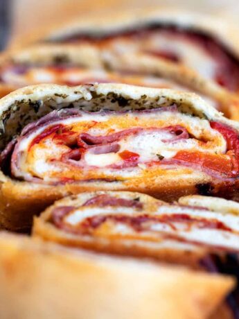 stromboli sliced on cutting board