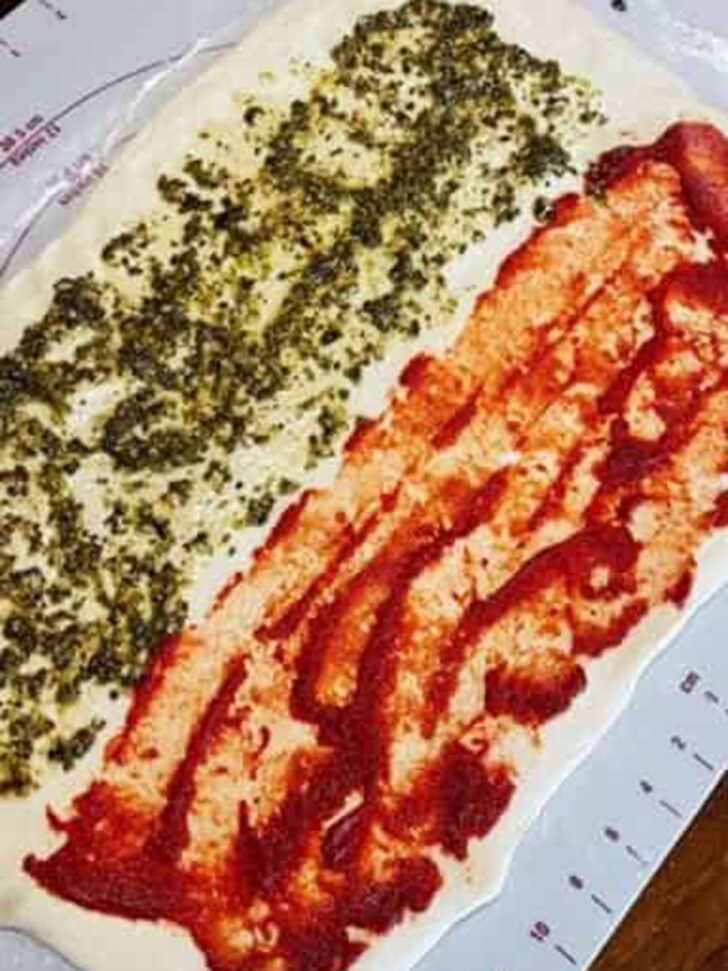 Pesto after spreading over the dough.