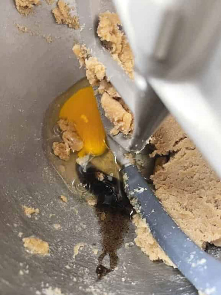 Adding the egg to the dough.