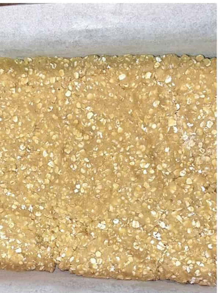 Dough pressed into the baking pan.