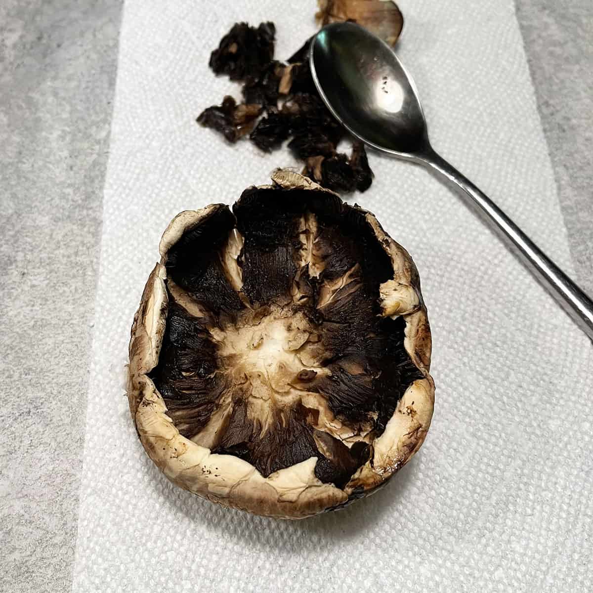 photo of removing the gills of portobello mushrooms