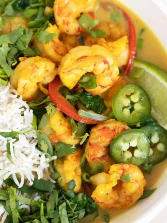 shrimp with coconut milk and rice in white bowl