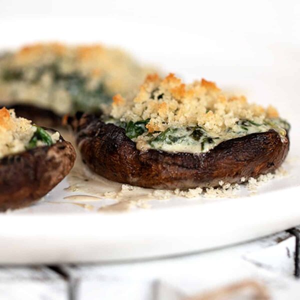 creamed spinach stuffed portobello mushrooms on plate