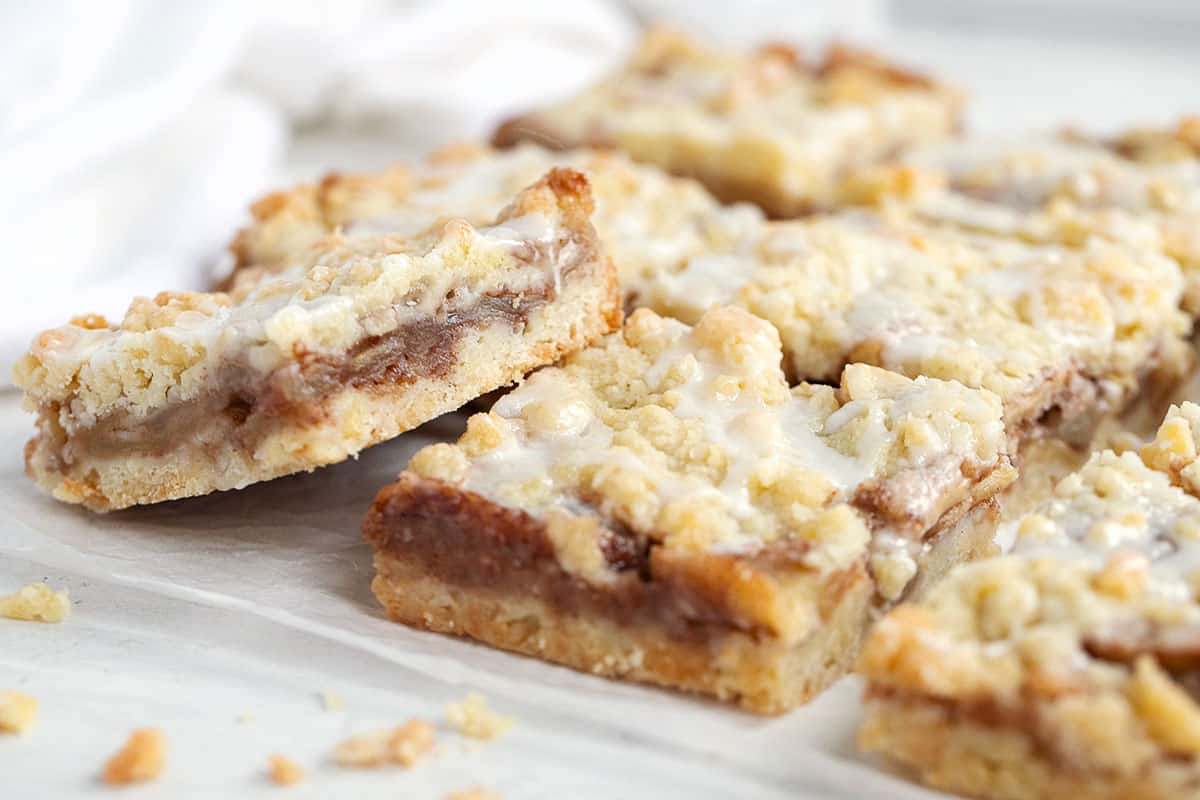 apple streusel bars cut on parchment paper