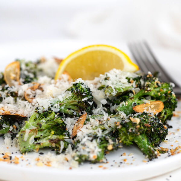roasted broccoli Caesar salad on plate with fork