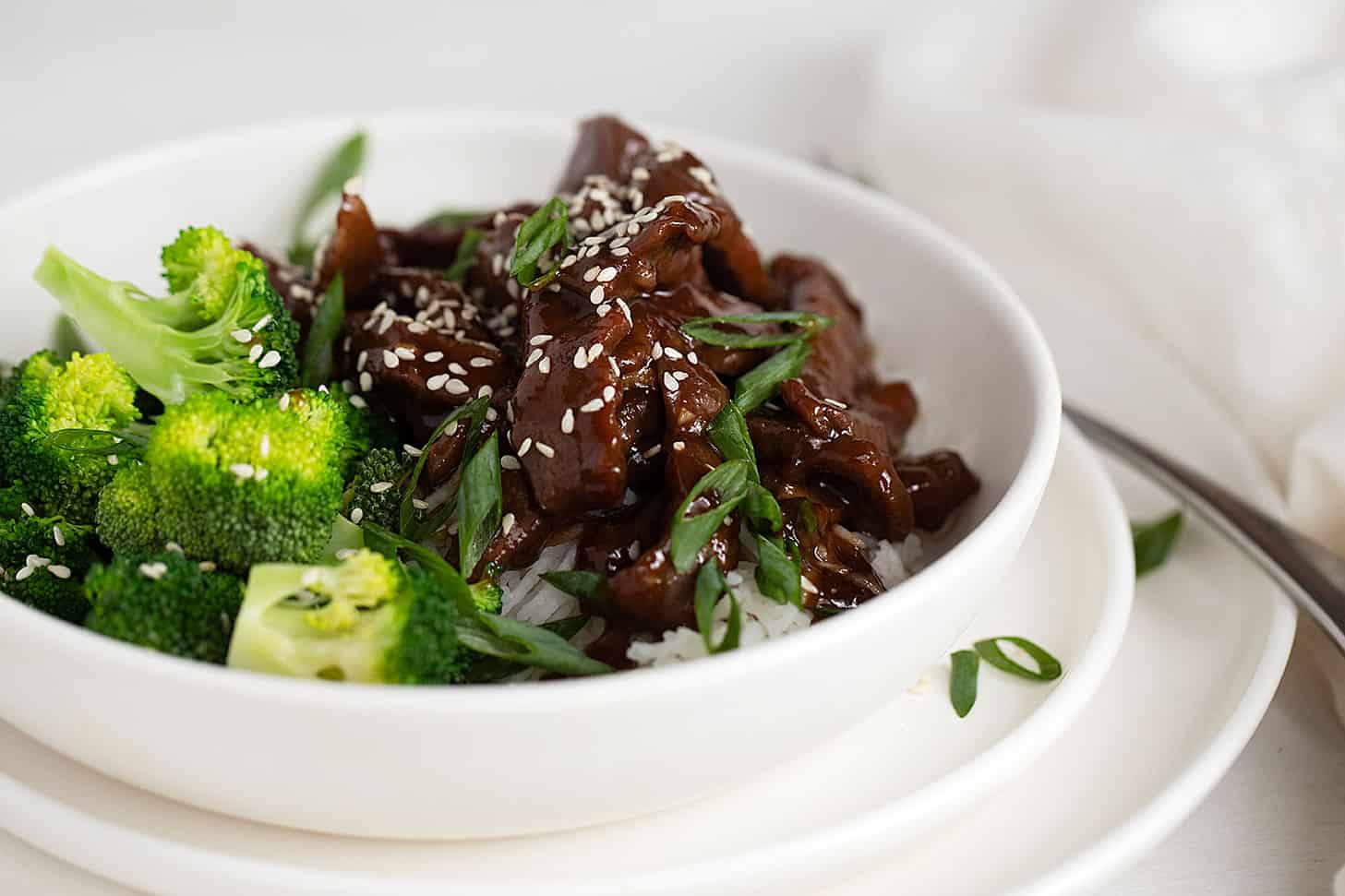 Mongolian beef in bowl with broccoli and rice