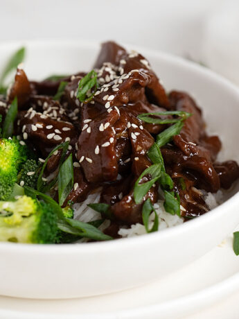 Mongolian beef in bowl with broccoli and rice