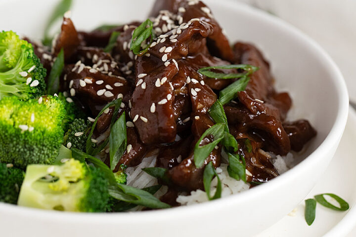 Mongolian beef in bowl with broccoli and rice