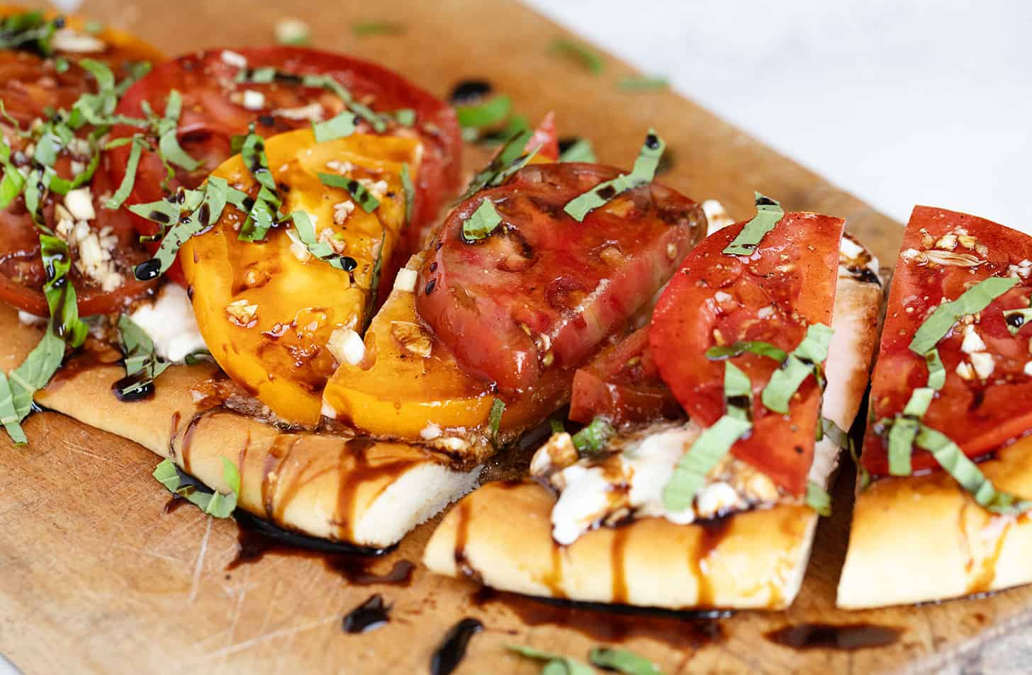 heirloom tomato flatbread on cutting board