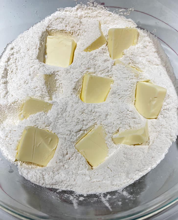 adding butter to flour mixture