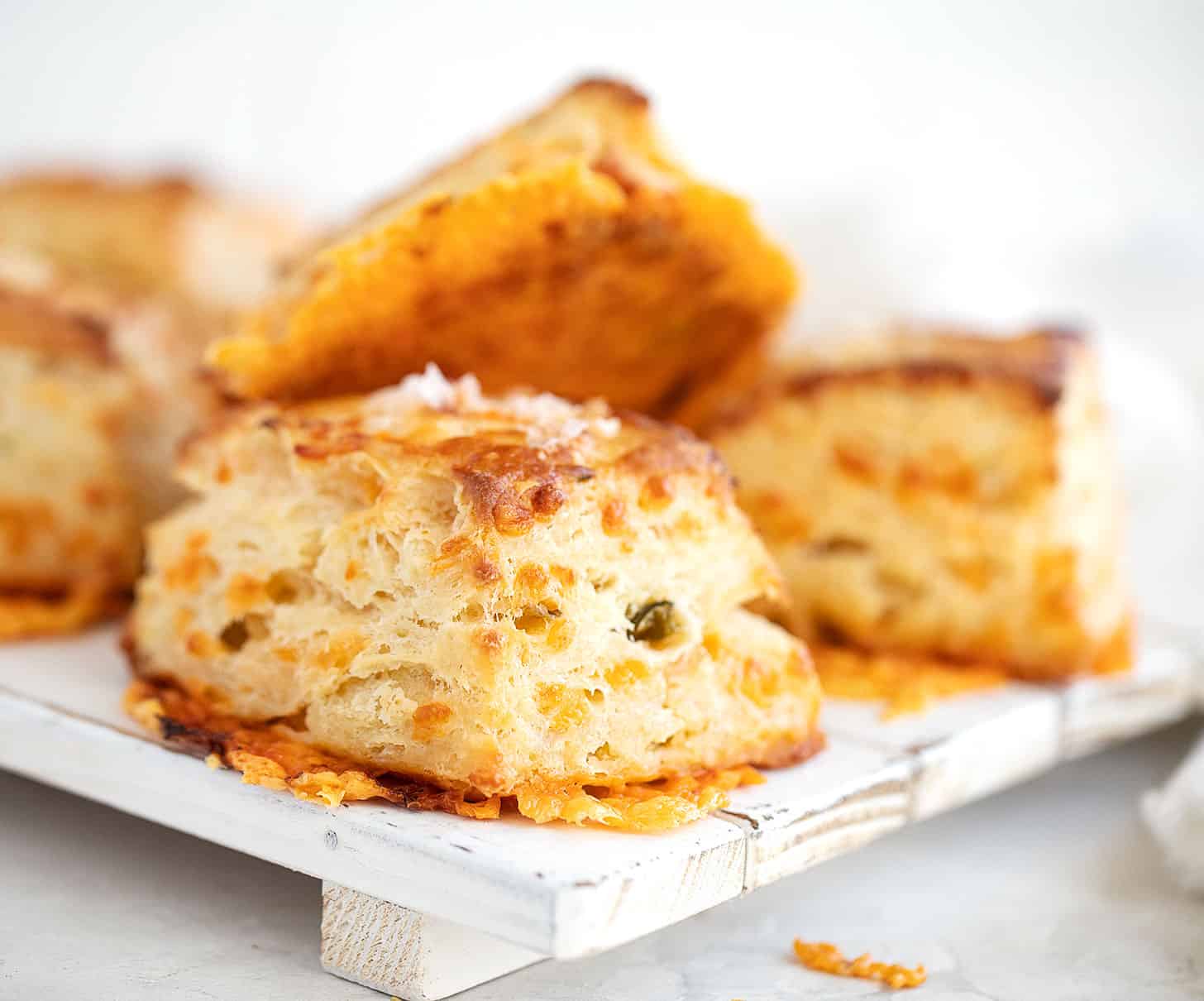 jalapeno cheddar biscuits on white board