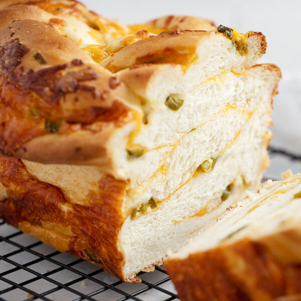 jalapeño cheese bread sliced on cooling rack.