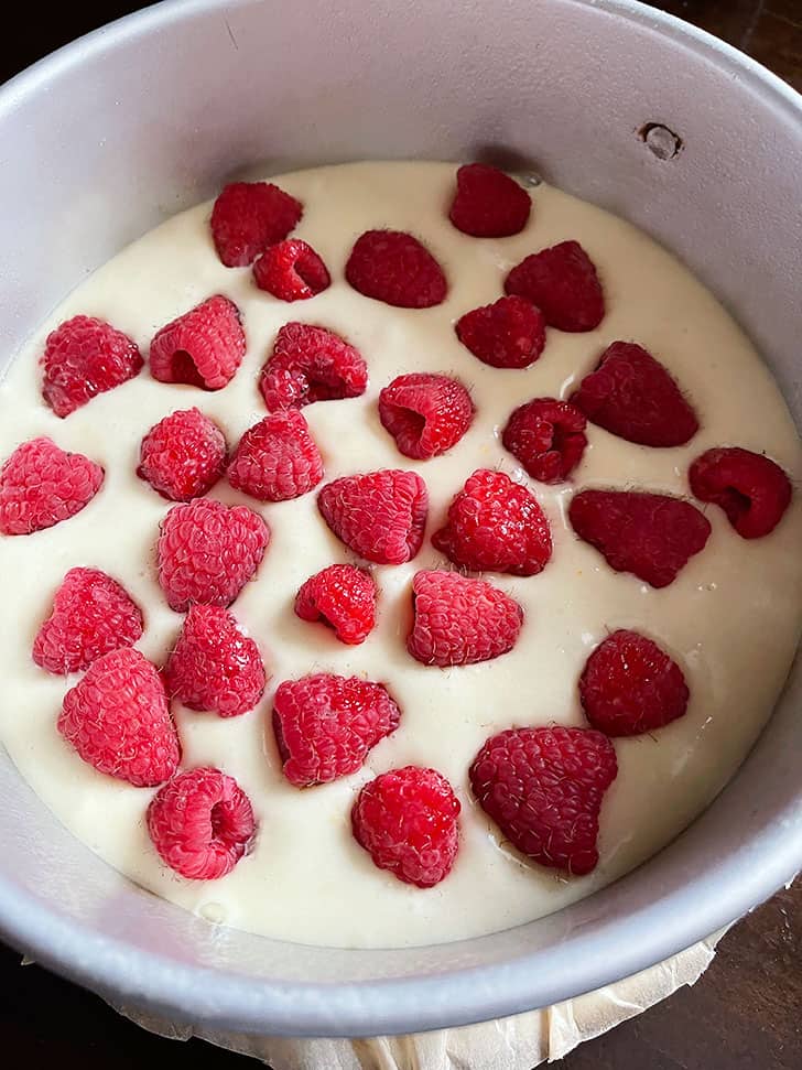 Add to pan and top with raspberries.