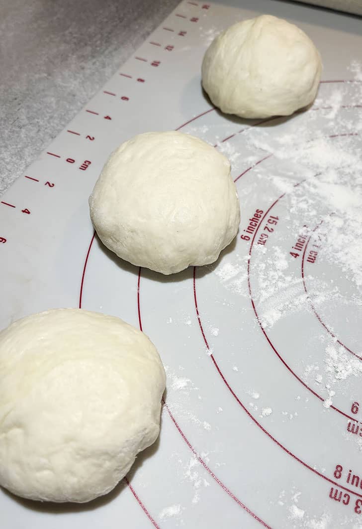 flatbread dough divided into 3 balls