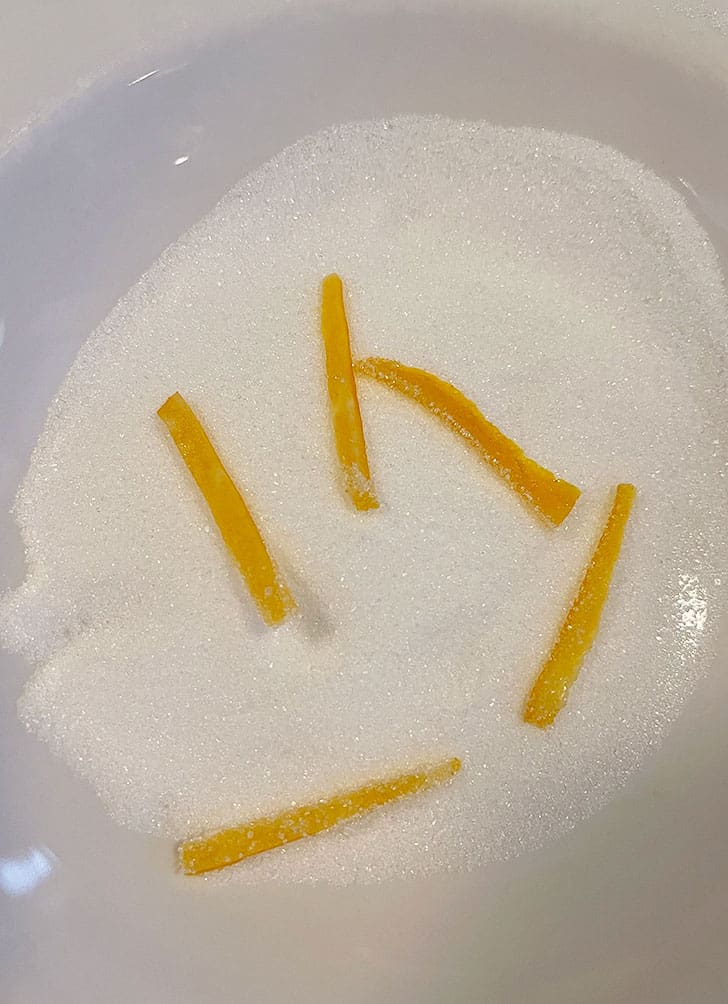 coating orange peels in sugar