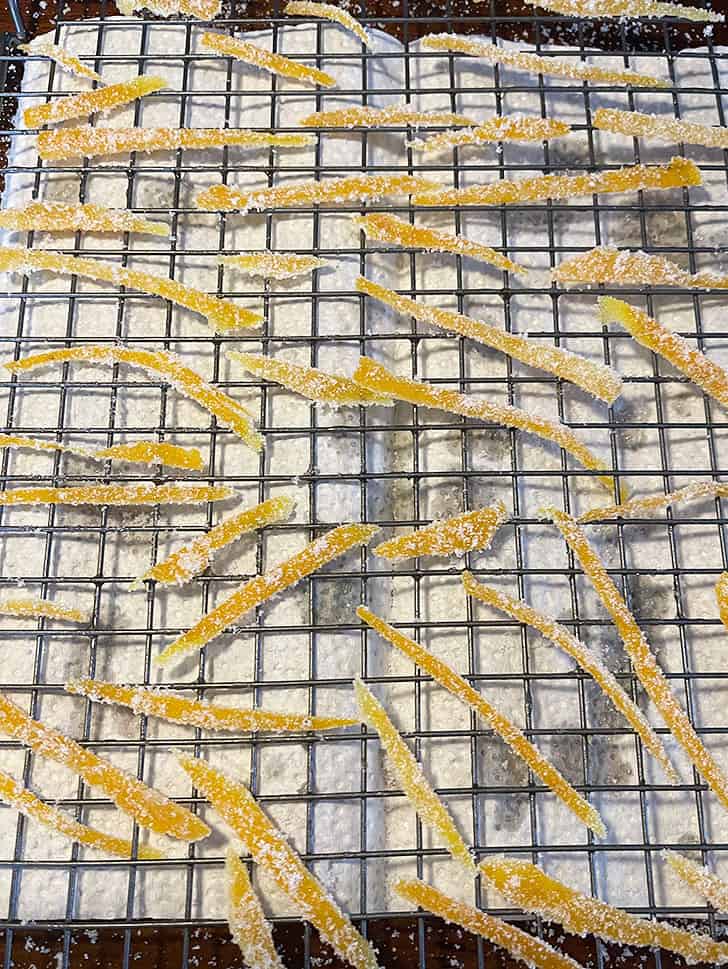 candied orange peel drying on cooling rack