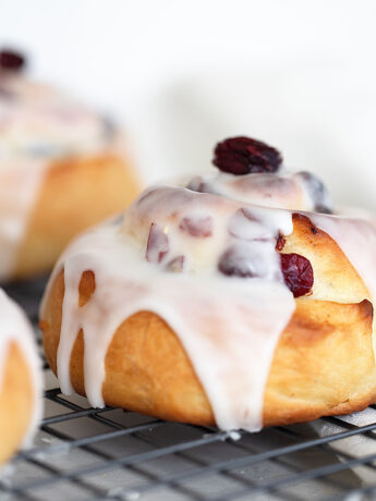 cranberry lemon buns on cooling rack
