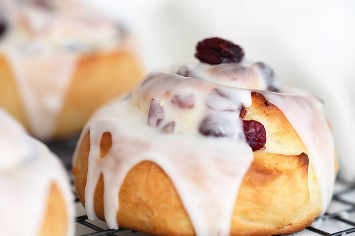 cranberry lemon buns on cooling rack