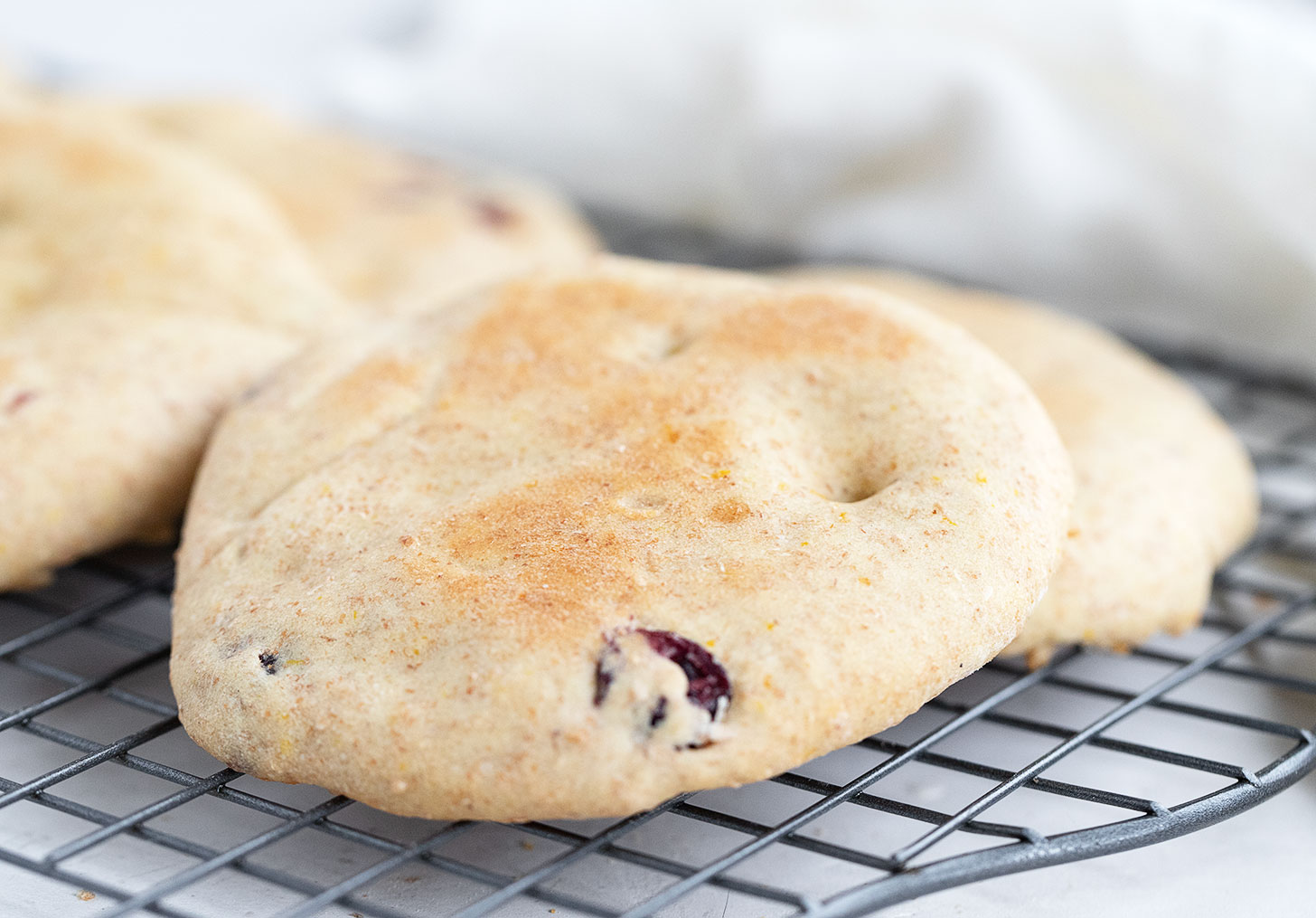 cranberry orange breakfast rounds on cooling rack