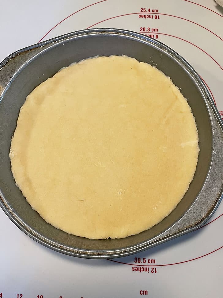 place dough circle in baking pan