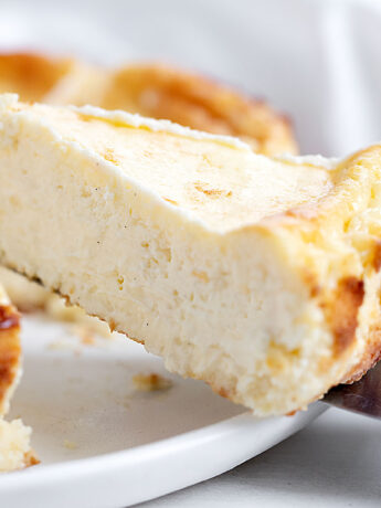 lemon Basque cheesecake sliced on white plate