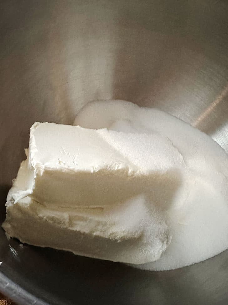 Cream cheese and sugar in mixing bowl.