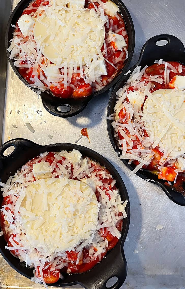 topping with slice of cheese and remaining Parmesan