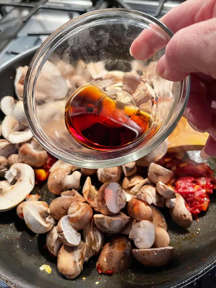 adding mushrooms and Marsala wine to pan