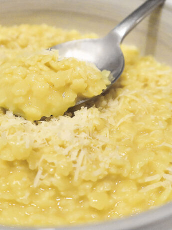 pastina with egg and cheese in bowl with spoon