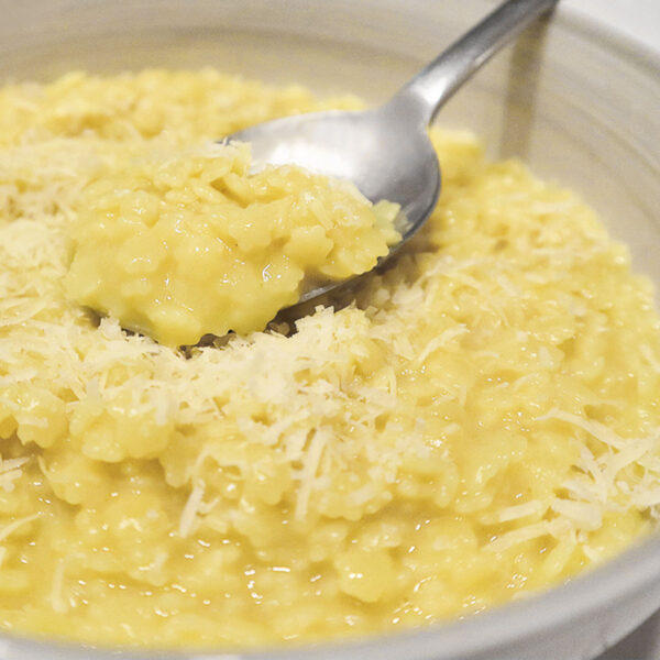 pastina with egg and cheese in bowl with spoon