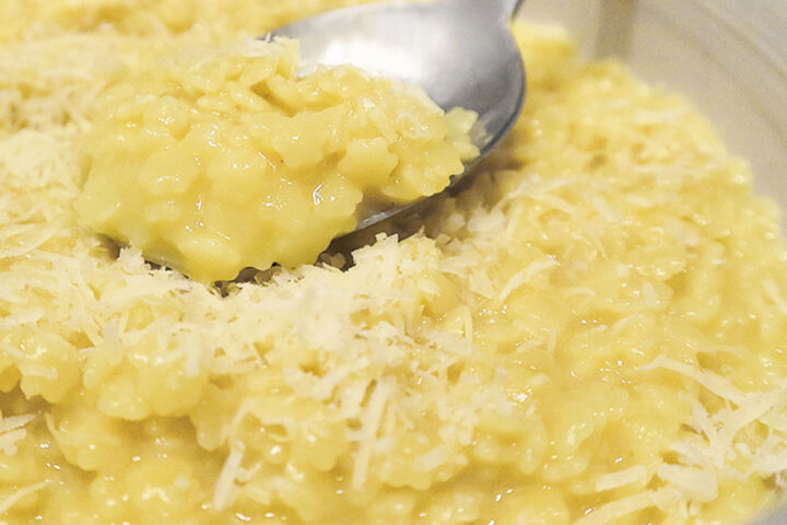 pastina with egg and cheese in bowl with spoon