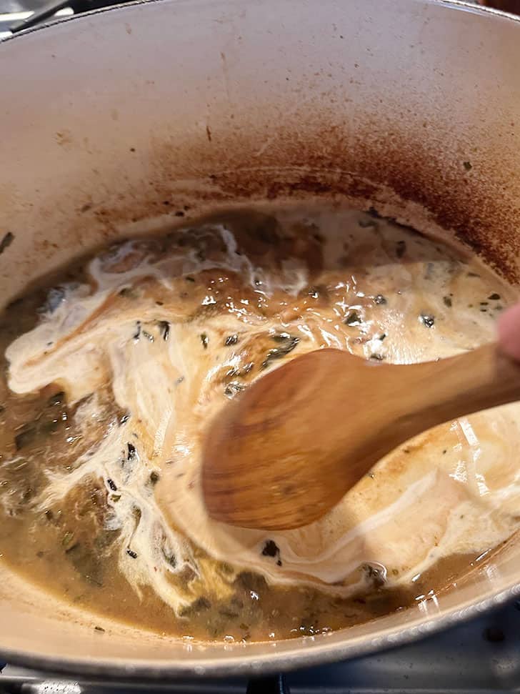 adding cream to pan