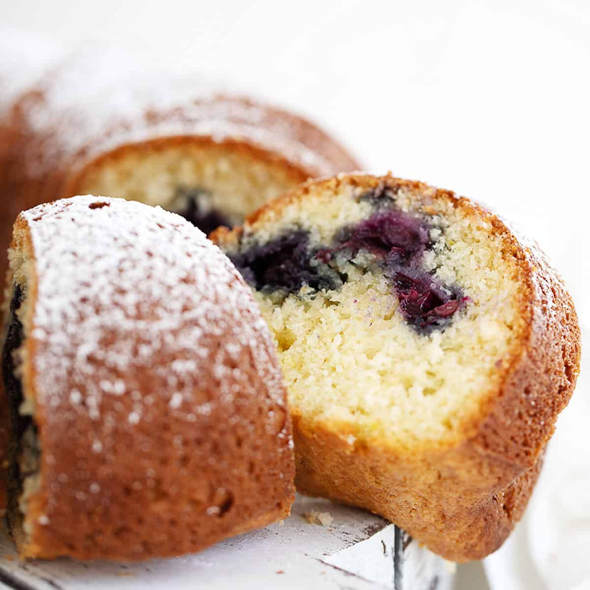 blueberry lemon bundt sliced on white platter