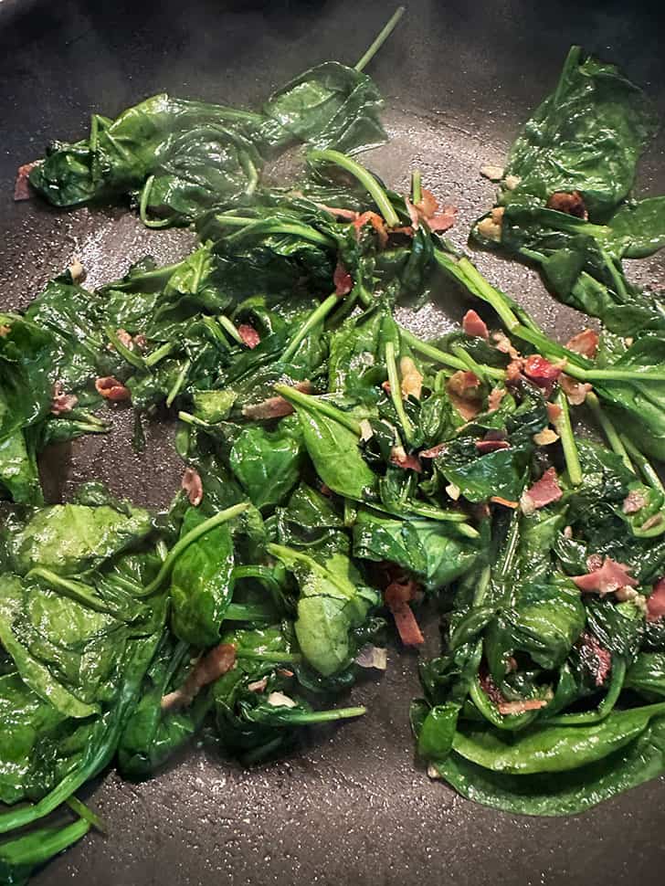 skillet after adding spinach and wilting