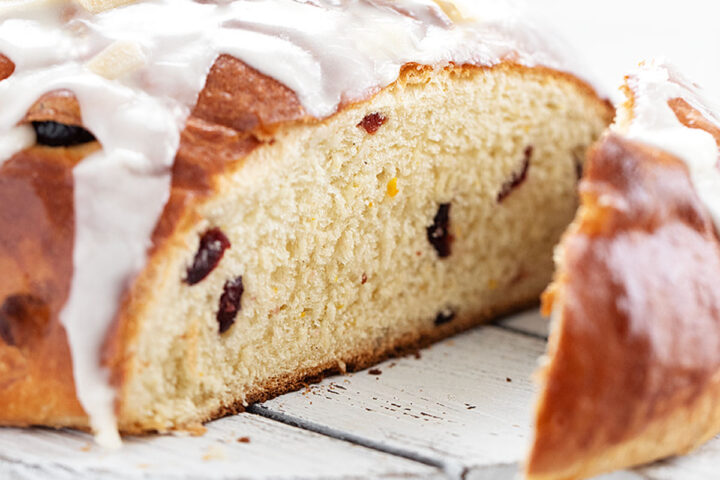 cranberry orange yeast bread sliced on cutting board