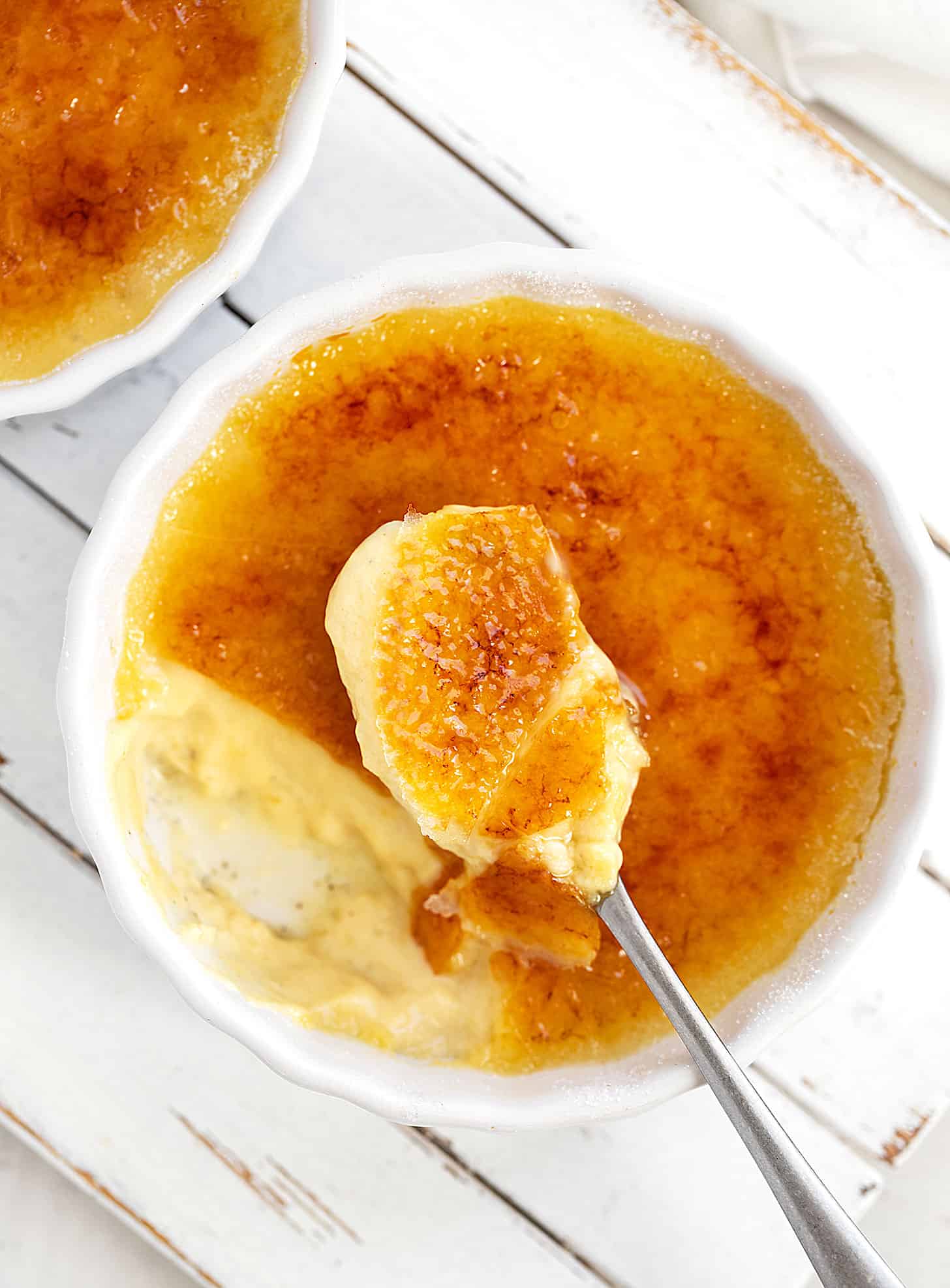 maple creme brulee in ramekin with spoon