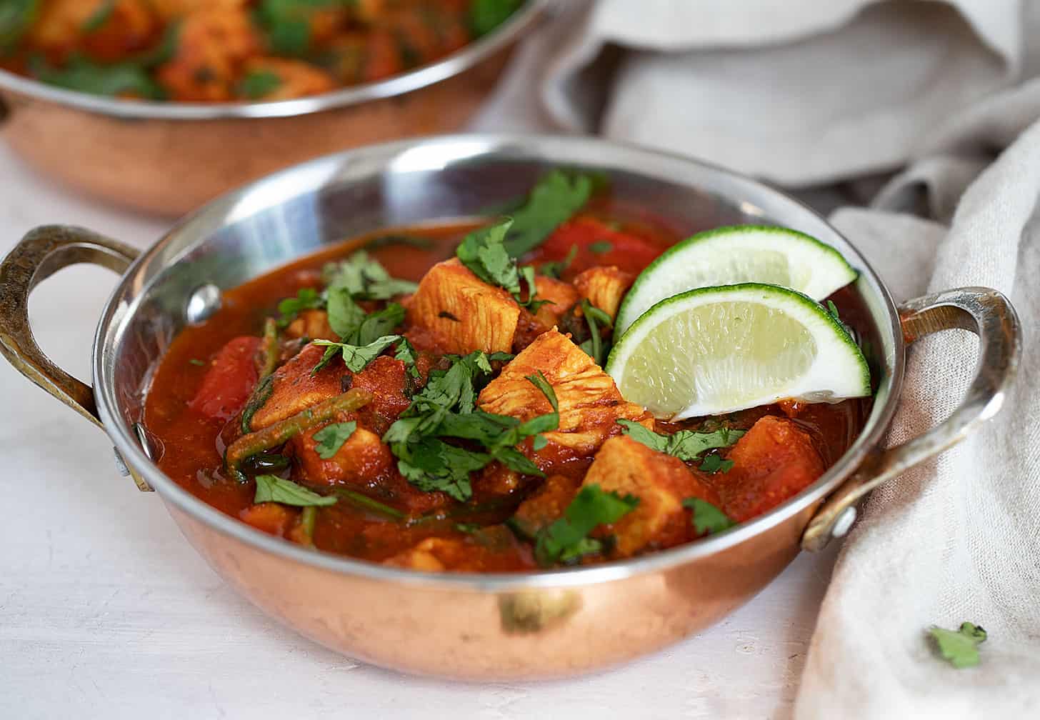 chicken batli in cooper serving dishes