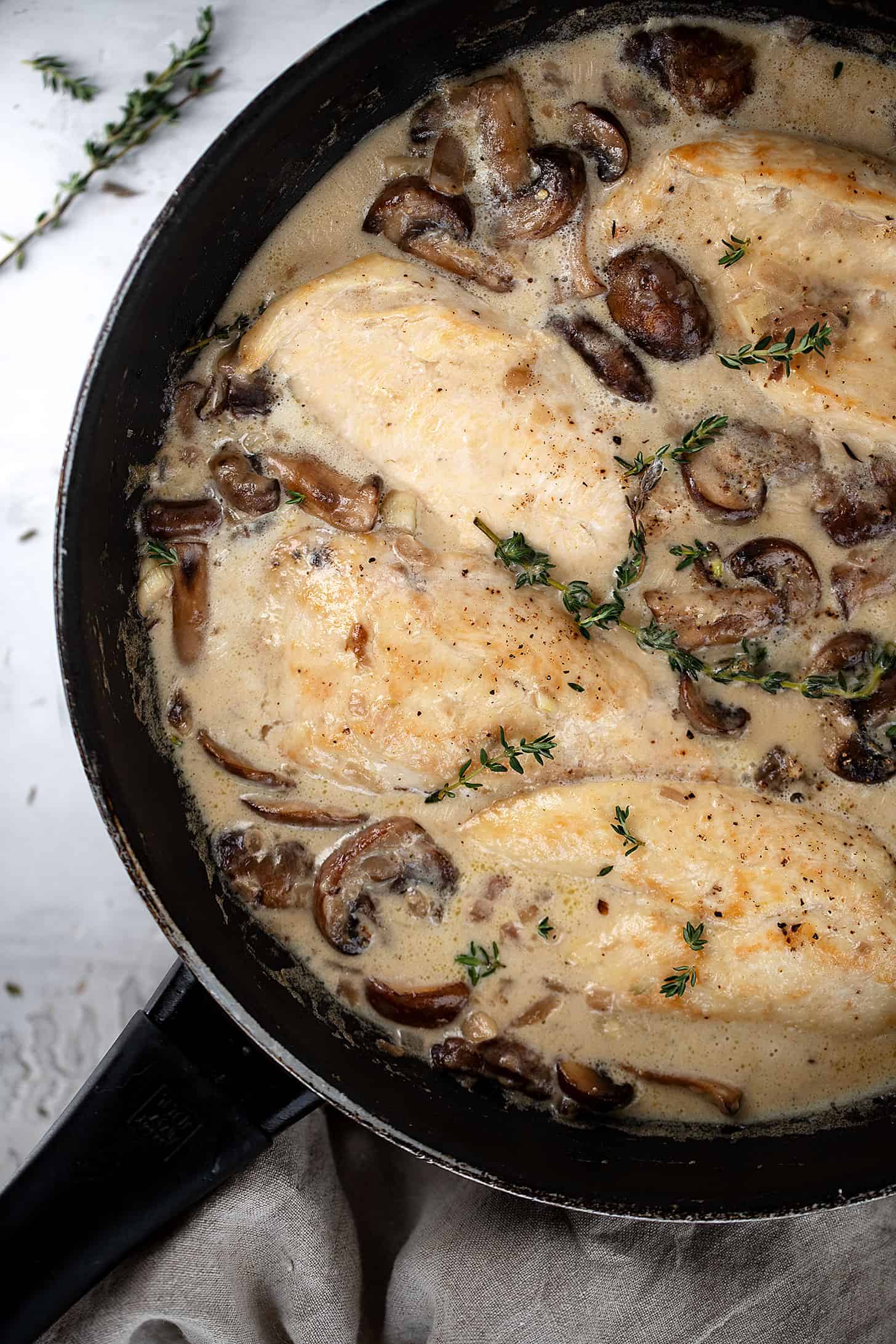 creamy garlic chicken with mushrooms in skillet