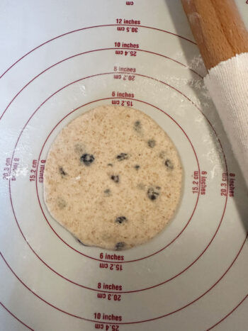 rolling dough balls into a flat circle