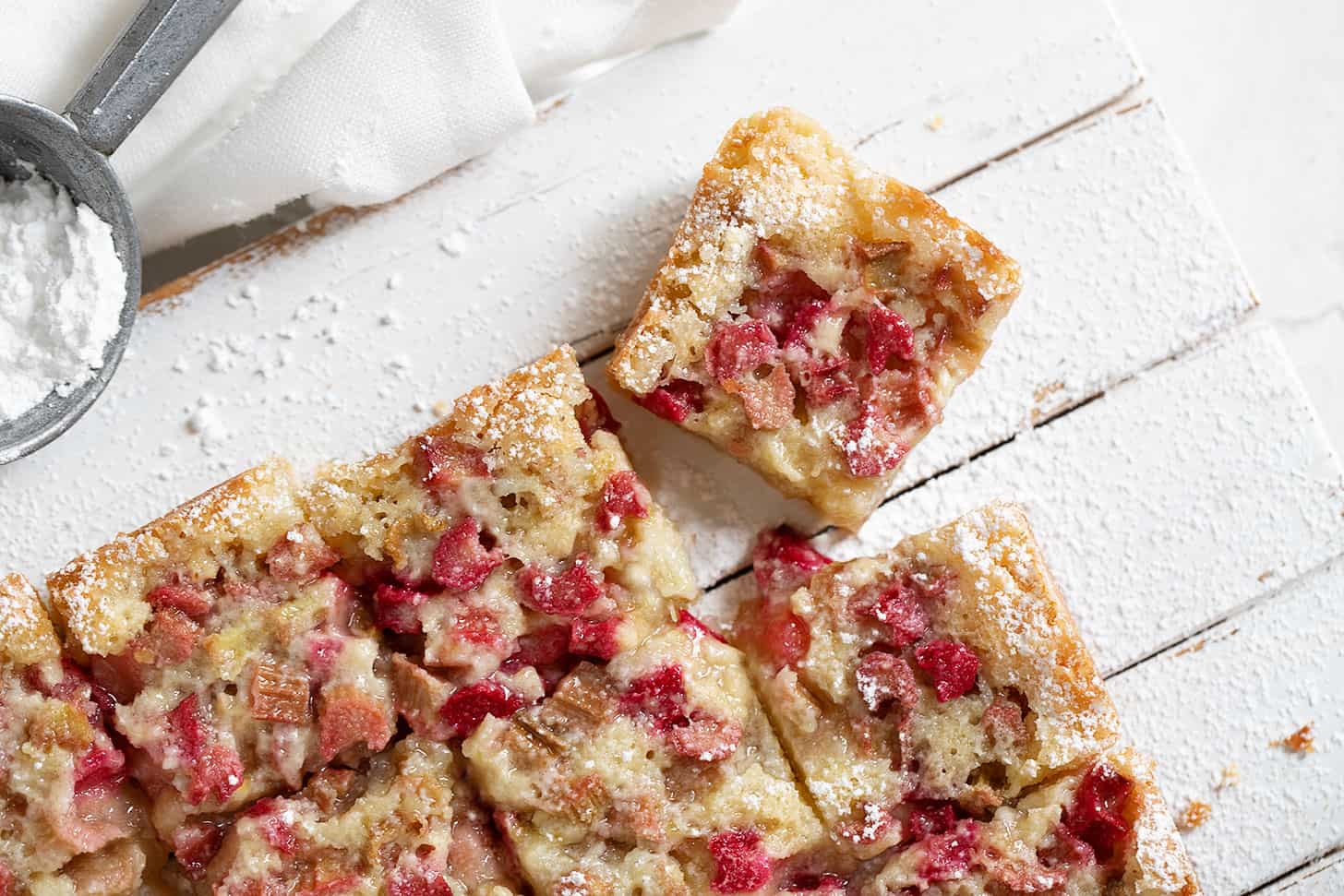 rhubarb bars cut on serving board