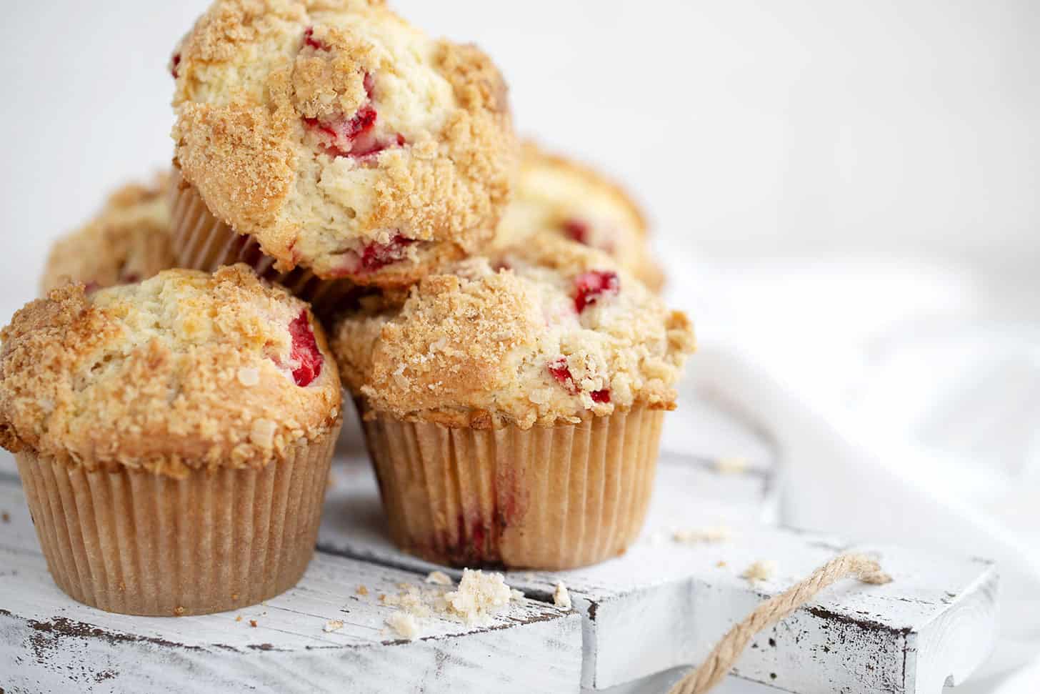 strawberry rhubarb muffins on serving board