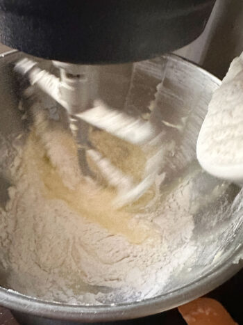 adding flour mixture to batter