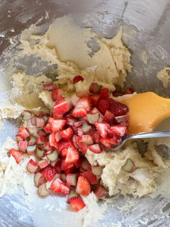 adding chopped strawberries and rhubarb to batter