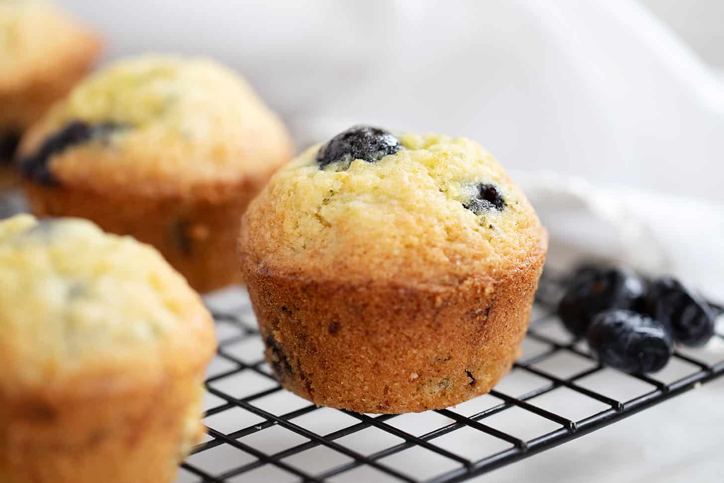 blueberry zucchini muffins on cooling rack