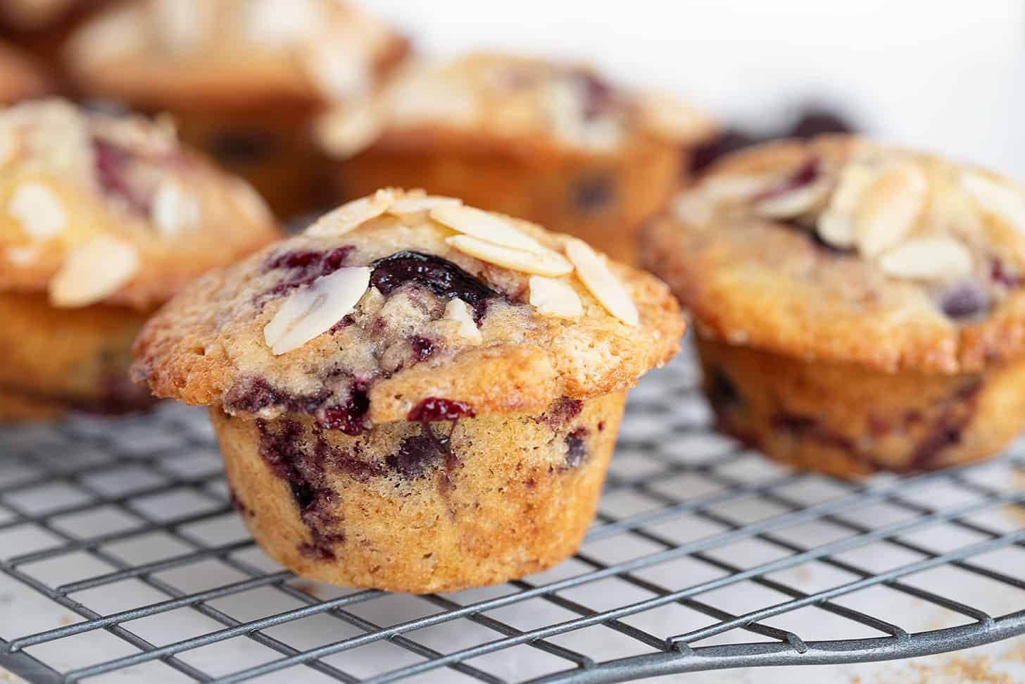 cherry muffins on cooling rack