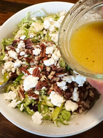 drizzling salad with vinaigrette