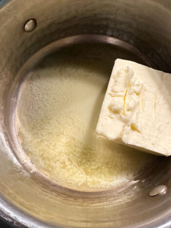 Melting butter in saucepan.